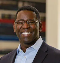 Headshot of Perry D. Wiggins, CFO, secretary, and treasurer for APQC.