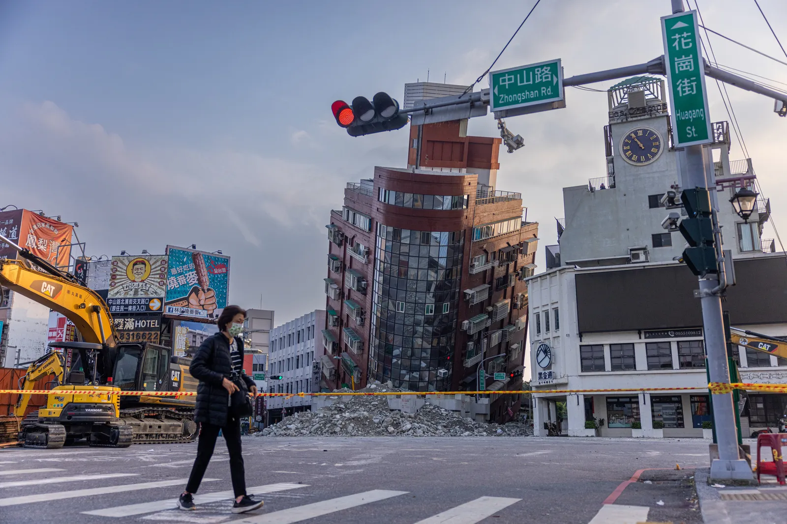 A person walks past an area of a damaged building is cordoned off following the earthquake on April 04, 2024 in Hualien, Taiwan.