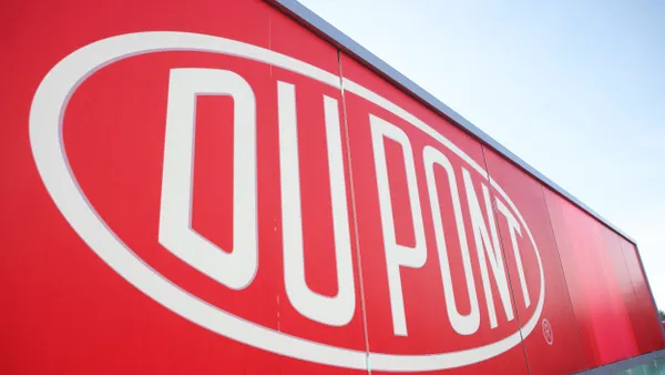 A big red sign with a white DuPont logo.