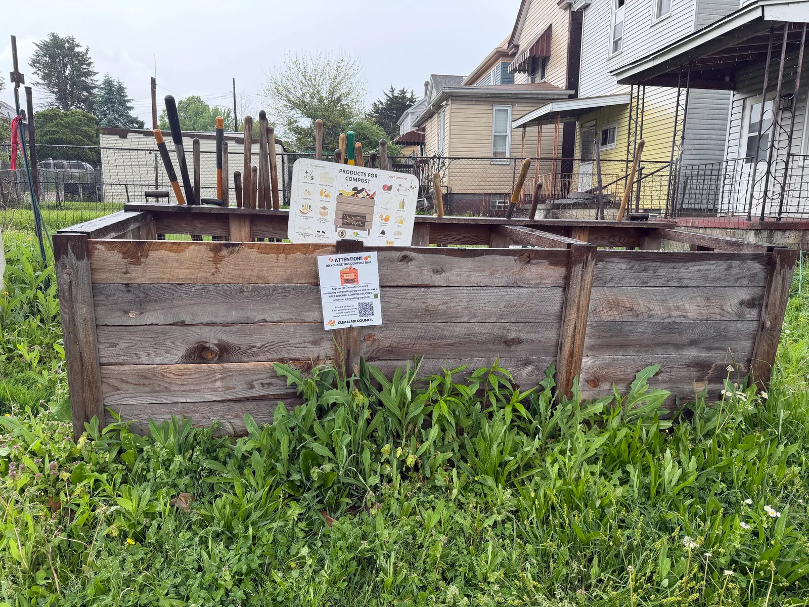 Composting setup with a sign reading "Products for Compost"