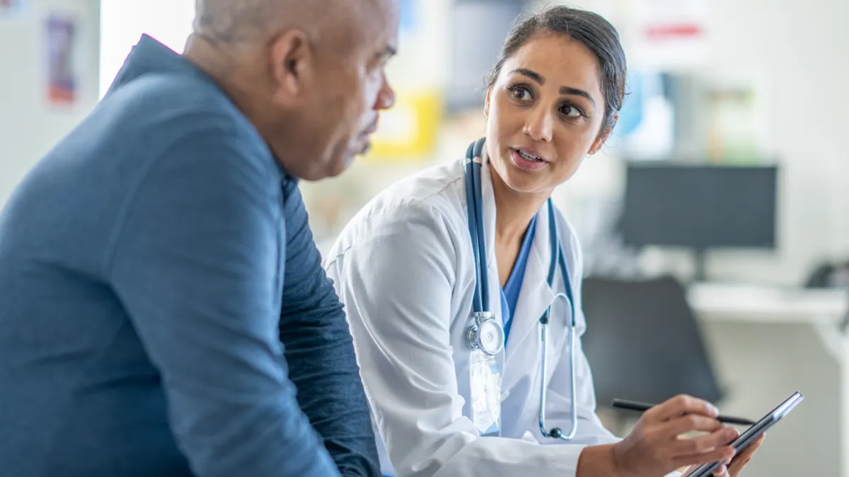 Medical professional speaking with a patient