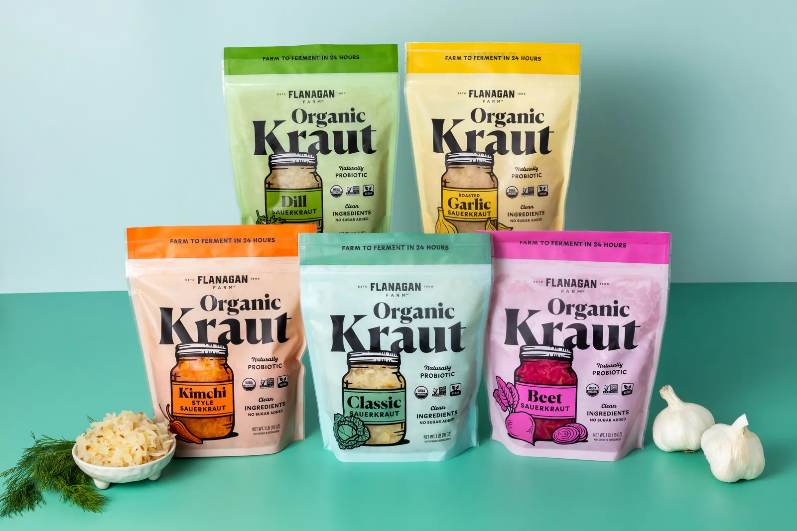 Five bags of a product called &quot;Organic Kraut&quot; lined up next to fresh garlic