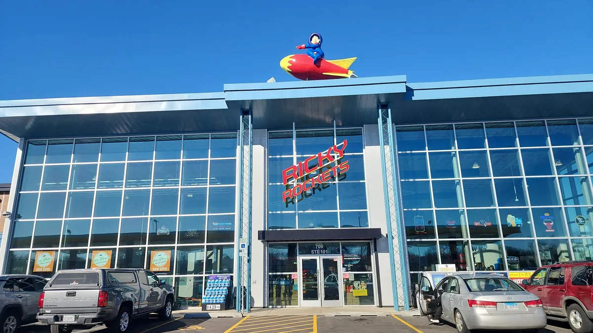 A photo of the exterior of a Ricky Rockets store.