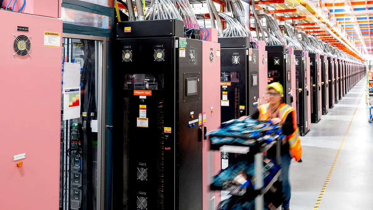 person working among server racks