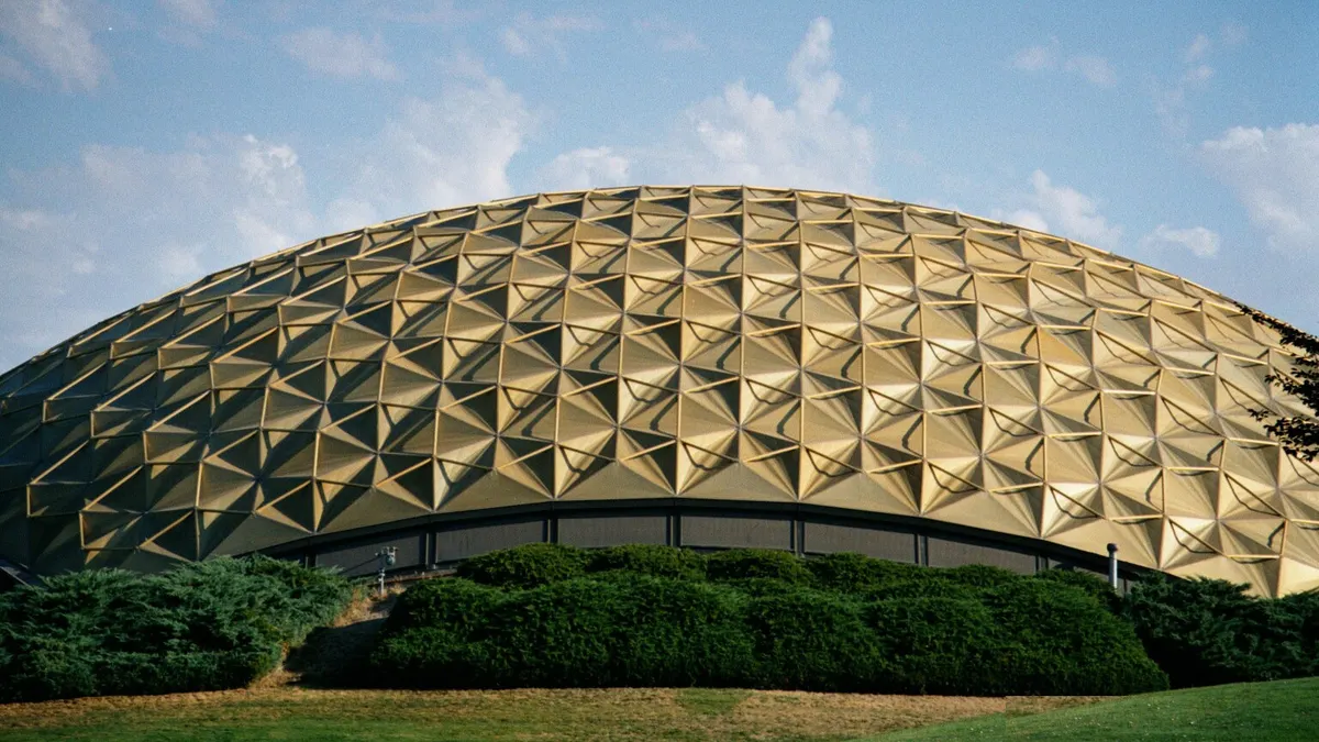 Patterned dome pavillion building on college campus.