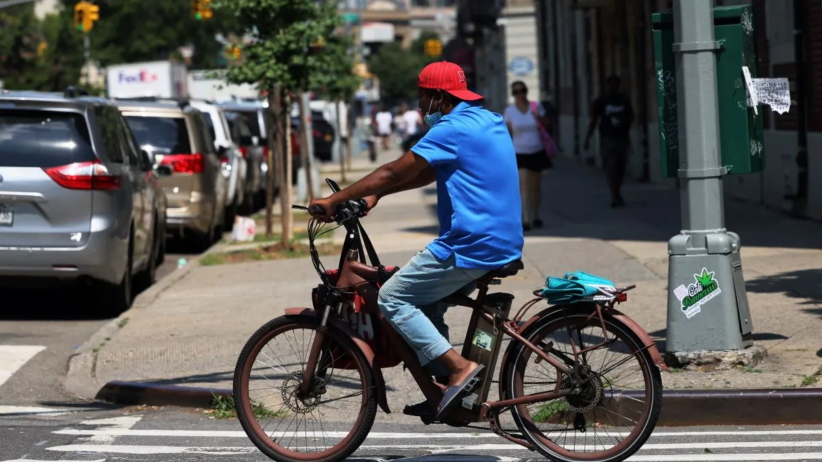 An image of a delivery courier in New York City