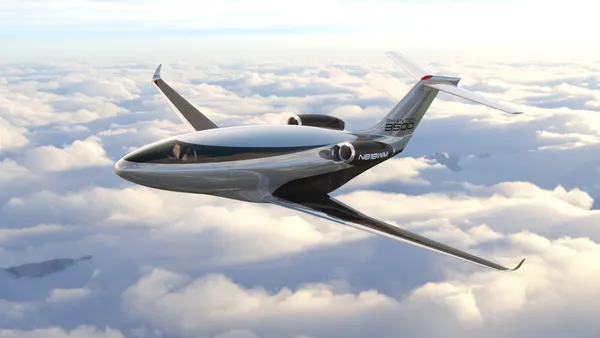 A plane looking like a silver bullet in the sky with the words "Phantom 3500" on it's rudder.