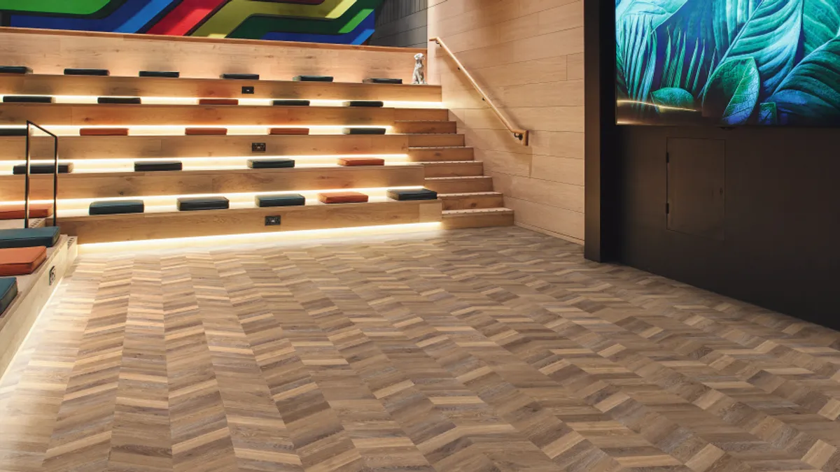 Wood flooring in a chevron configuration.