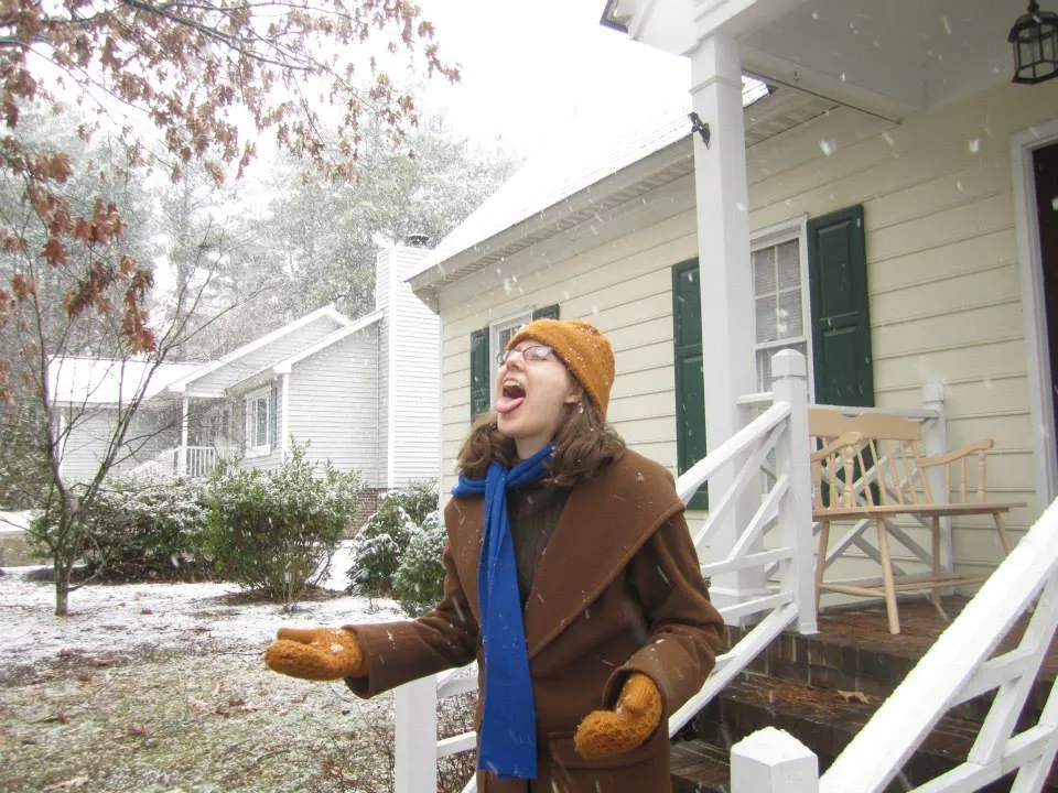 AnnaLeah Karth catching a snowflake.