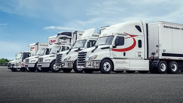 A row of freight trucks and trailers from Ryder System.