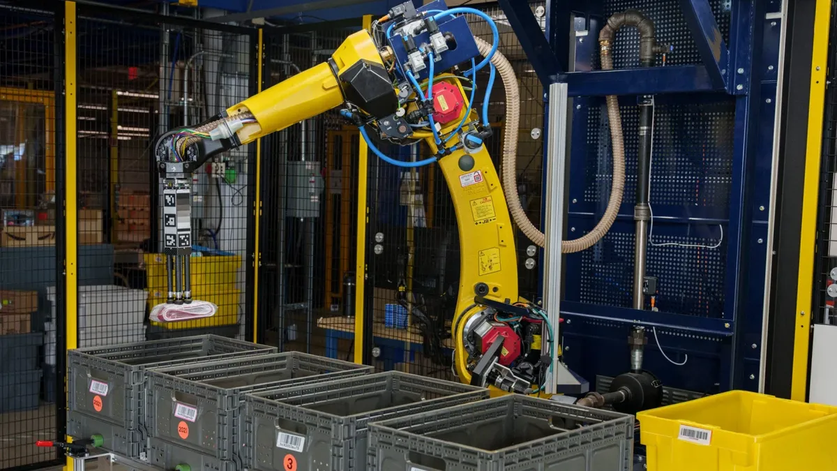 Amazon's intelligent robotic system Sparrow moves an item in an Amazon warehouse.