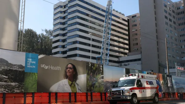 A wall surrounds a construction site on the UCSF Parnassus campus.