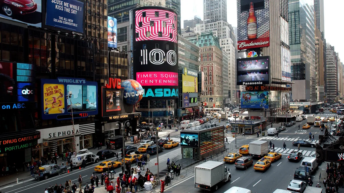 Image shows Times Square with billboards.