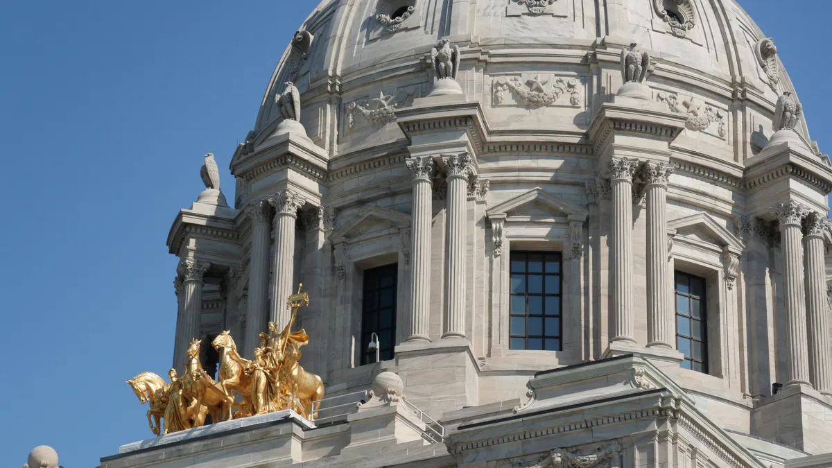 A close up of the white dome on a government building.