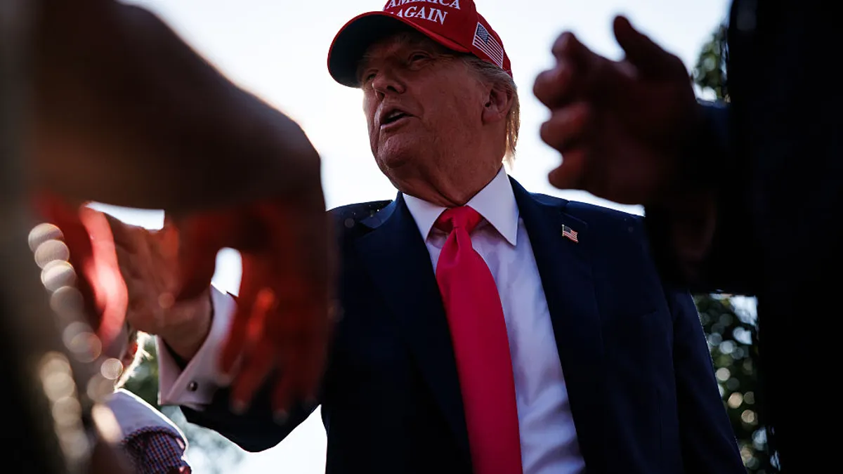 U.S. President Donald Trump greets guests after delivering remarks during a military family picnic on the South Lawn of the White House on July 4, 2025.