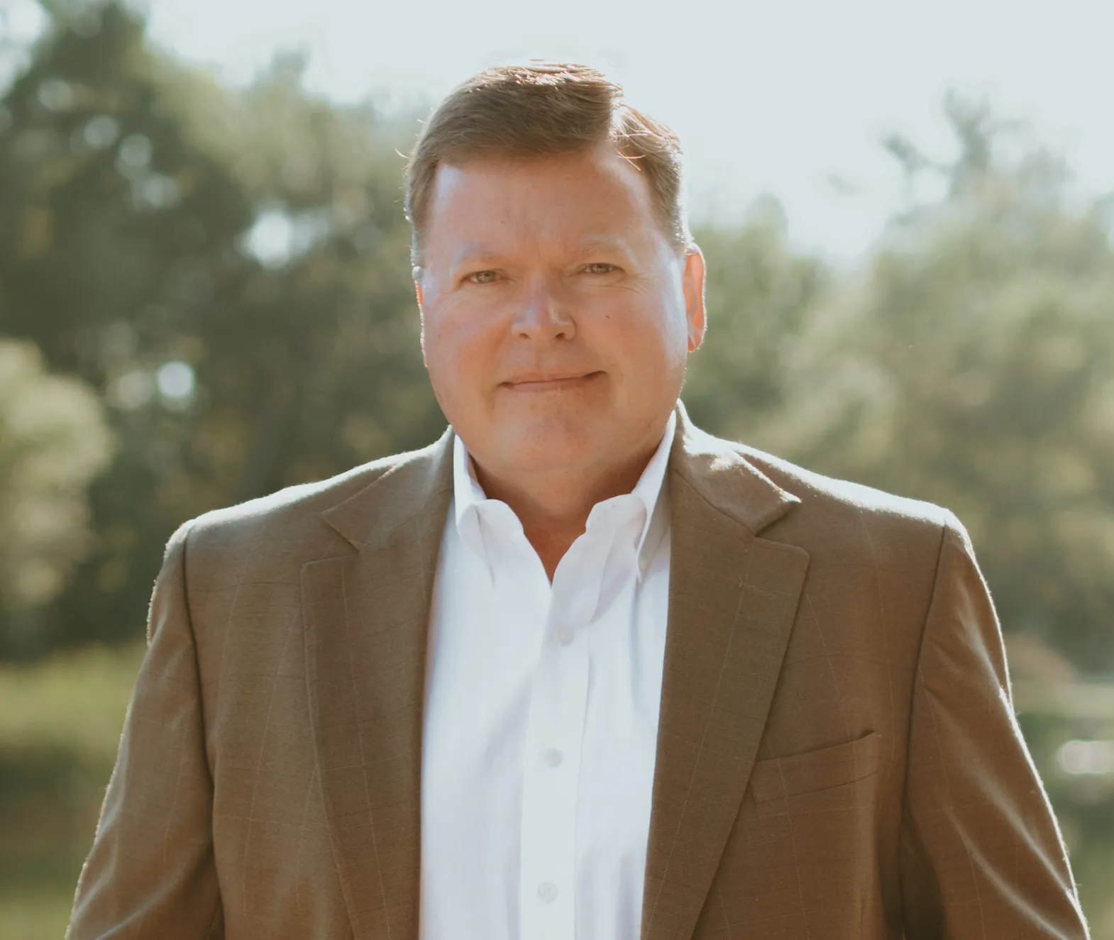 headshot of Rob Shockley, EVP and general counsel of Synergy One Lending