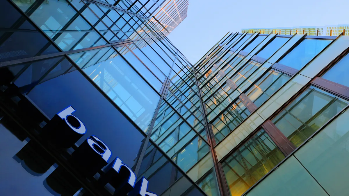 Bank corporate finance building seen from below. The sign "bank" visible close.