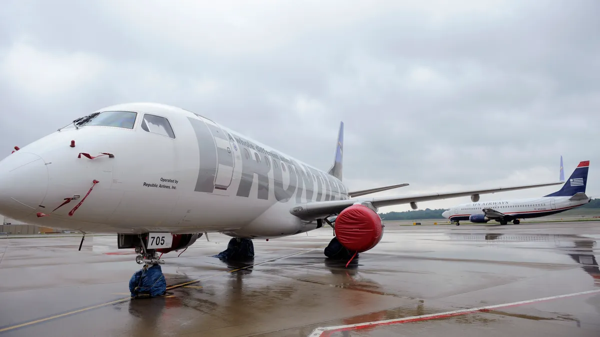 A plane on the tarmac of an airport.