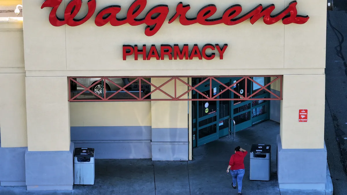 Aerial view of a customer entering a Walgreens store.