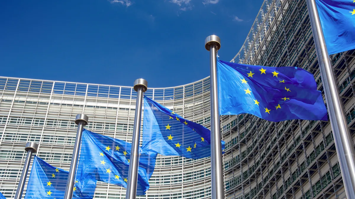 EU flags in front of the Berlaymont building, headquarters of the European Commission in Brussels, Belgium.