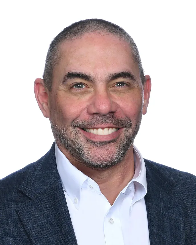 Headshot of a man in professional attire.