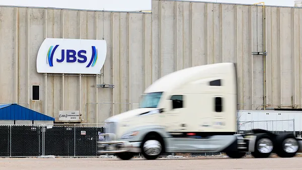 A truck seen driving past a JBS meat plant.