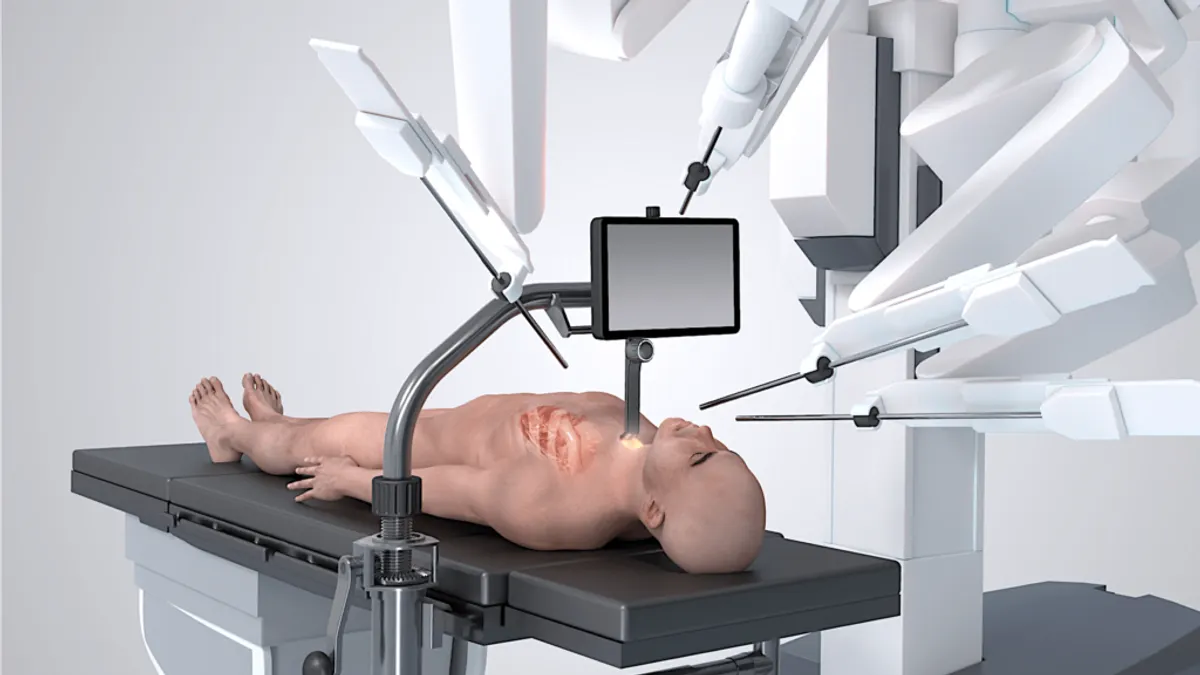 The robot-enhanced heart valve replacement system is depicted in an illustration that includes a patient on a table.