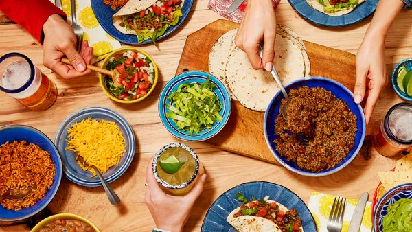 Table full of all the things to make tacos at home