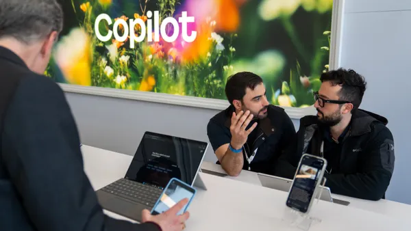 Microsoft employees demonstrate Copilot after an event highlighting the AI tool on April 4, 2025 in Redmond, Washington.