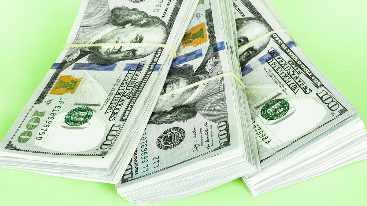 Stack of one hundred dollar bills.