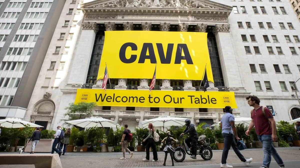 An image outside the NYSE with Cava sign