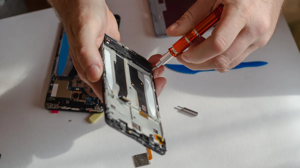 Person repairing a smartphone