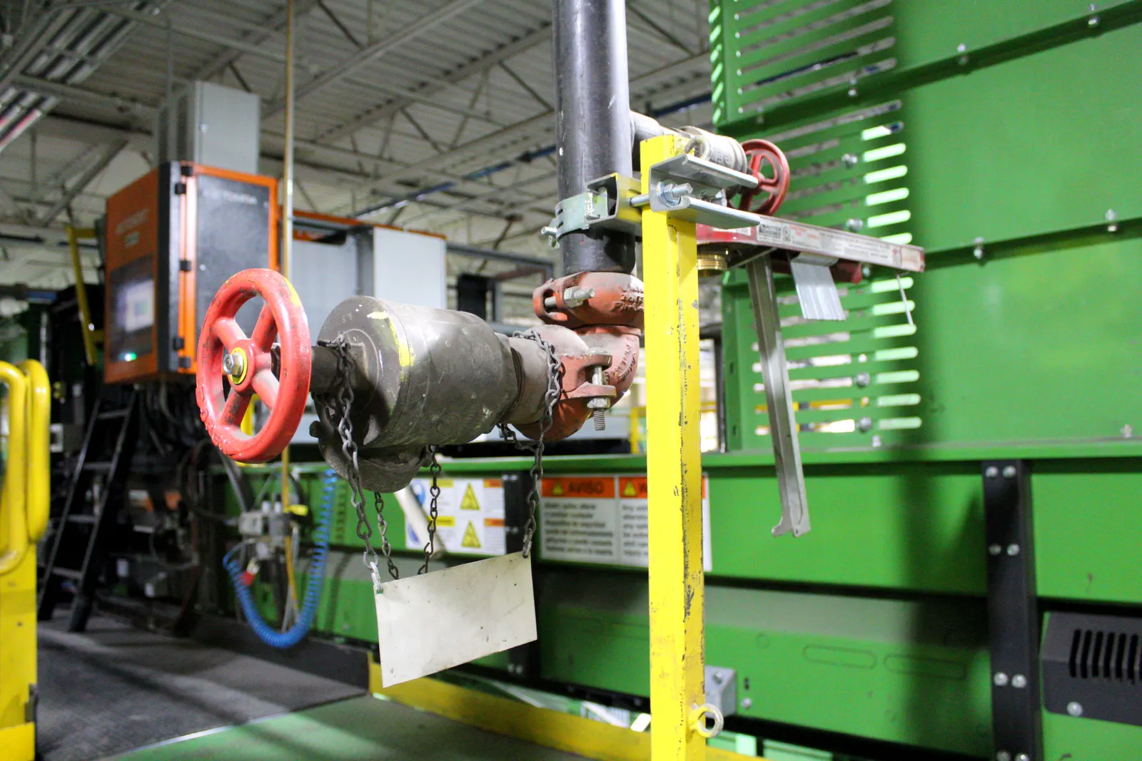 A stand pipe inside an industrial facility.