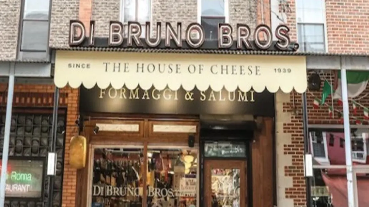 Exterior of a grocery store with a sign that reads "Di Bruno Bros." in capital letters above the entrance.
