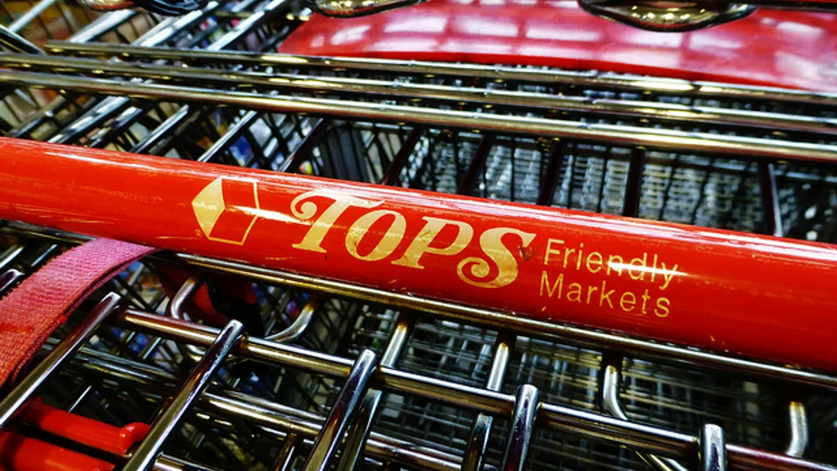 Shopping carts that say "Tops Friendly Markets" on the handles