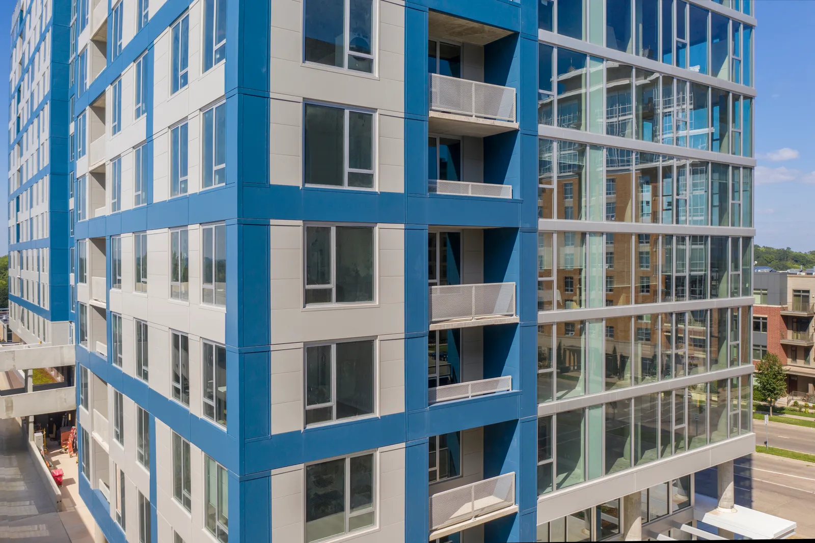 The side of a building, with blue and white paneling.