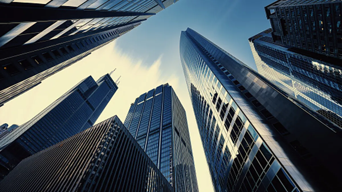 Modern tower buildings or skyscrapers in financial district with cloud on sunny day in Chicago, USA.