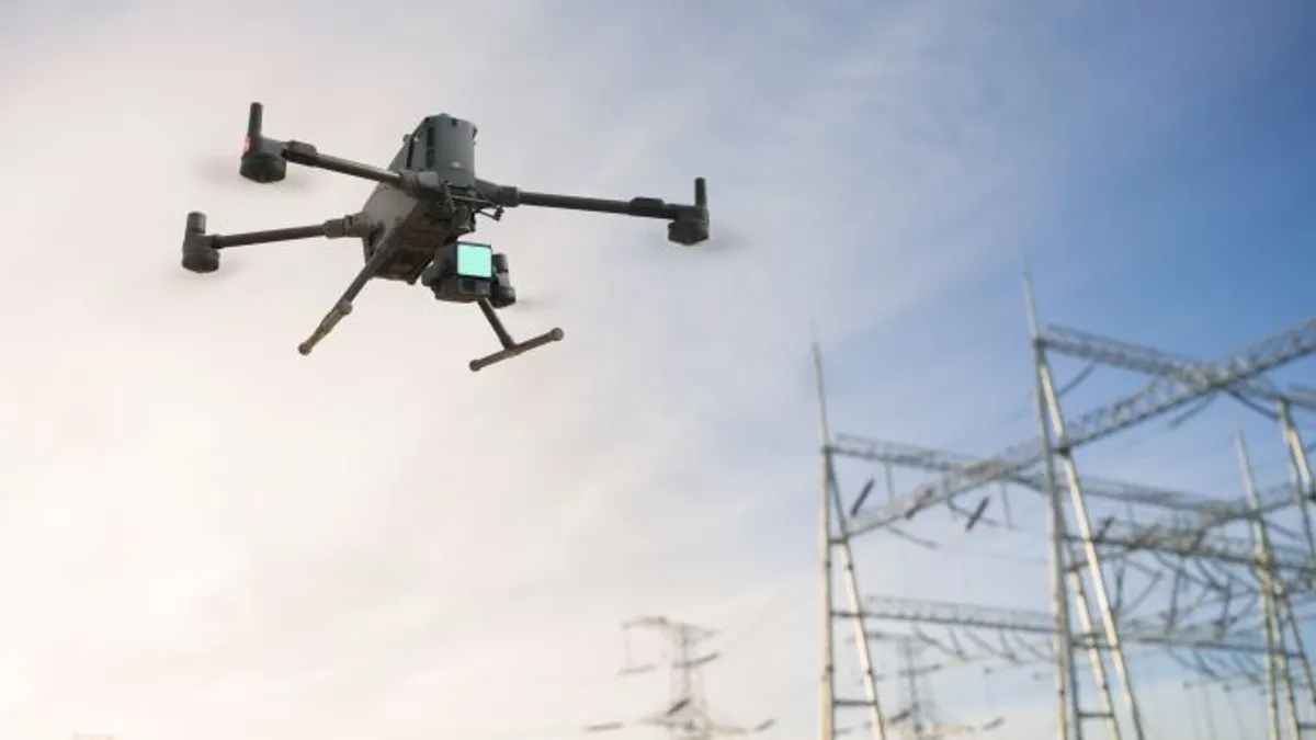 a drone flies near electrical lines