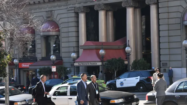 A photo of people walking in front of the Westin St. Francis Hotel in San Francisco