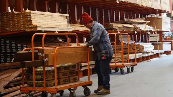A customer shops for lumber at a Home Depot store