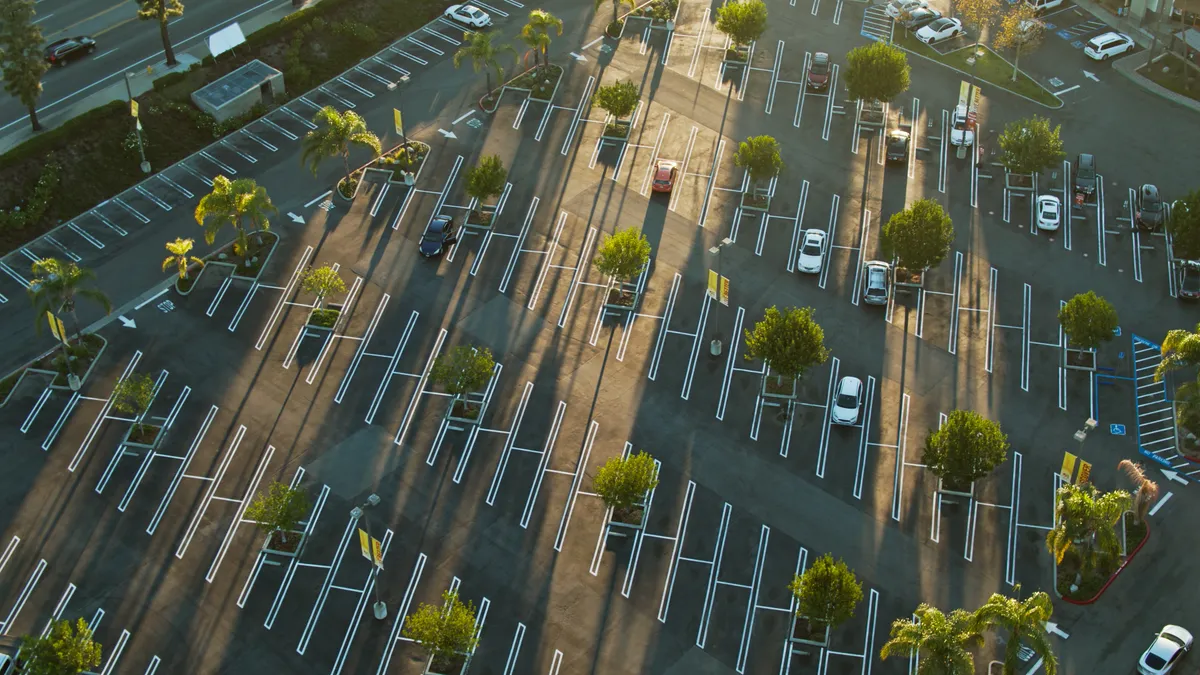 A mostly empty strip mall parking lot in California.