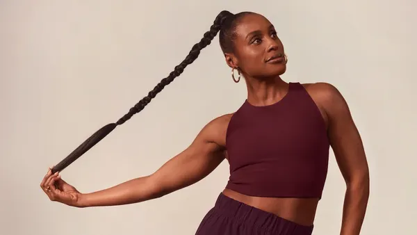 Issa Rae wearing Beyond Yoga garments in maroon