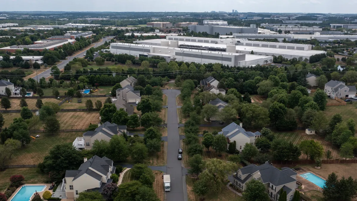 Data centers are shown situated near a neighborhood in Ashburn, Virginia.