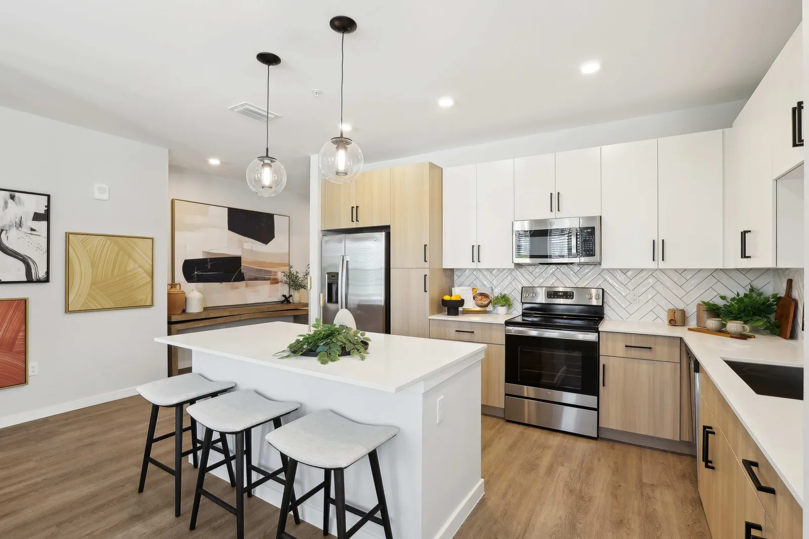 A kitchen with white walls.