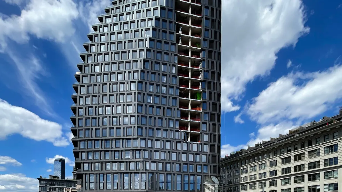 A high-rise apartment building with a slightly twisted shape.