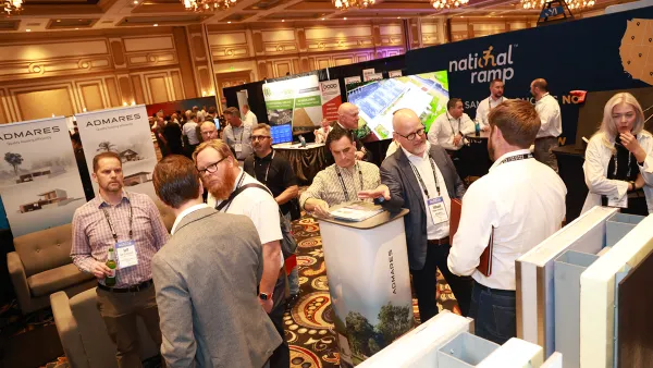 People standing around and talking to one another at a work conference