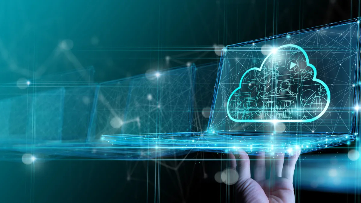 Hand showing laptop computer with cloud network Computer connects to internet server service for cloud data transfer.Cloud computing technology and online data storage for business network concept.