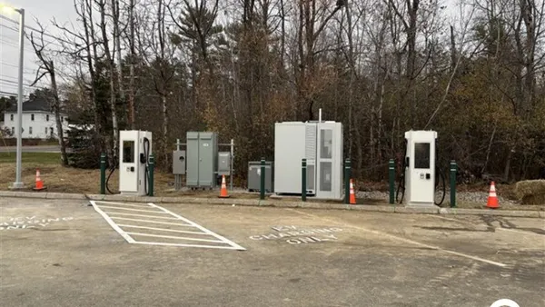 A photo of EV chargers in a parking lot.