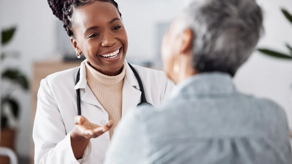Happy, medical or nurse with a mature person talking or speaking of test results or advice