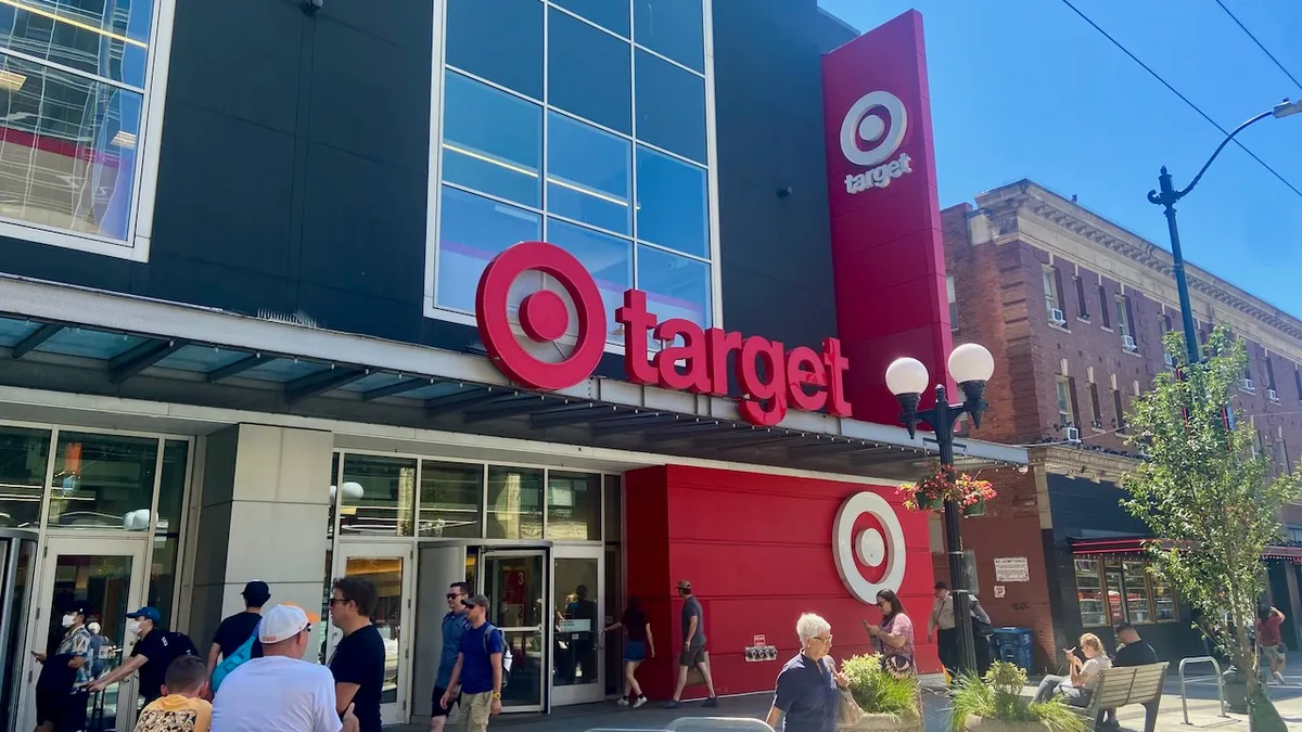 People walking past and into a store.